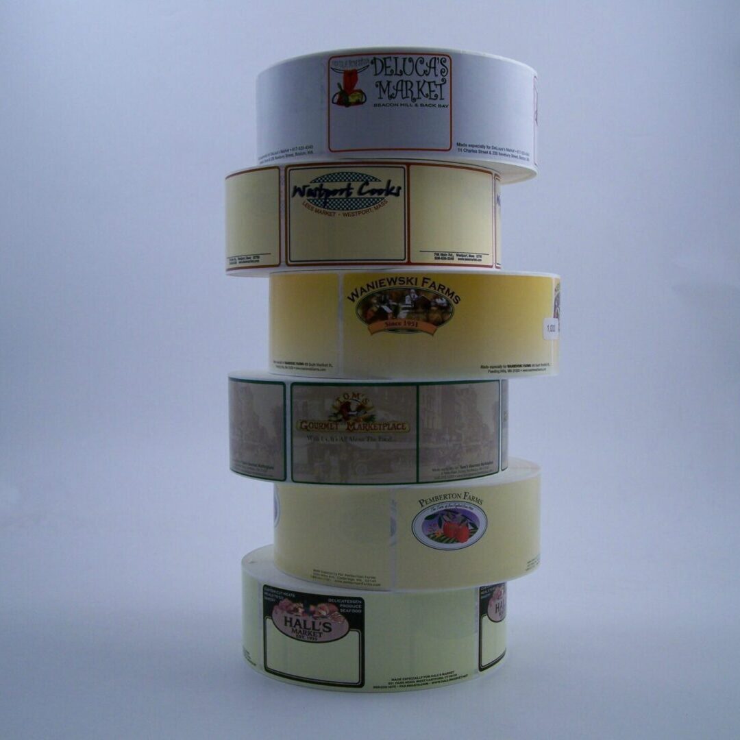 A stack of six rolls of tape with different designs.